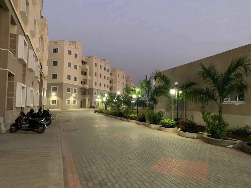 Paradise Hills internal road with street lights in the evening